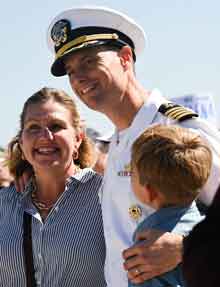 Capt. Ethan Rule, commanding officer of the amphibious assault ship USS America (LHA 6), reunites with his family during the ship’s homecoming ceremony at Naval Base San Diego, Sept. 25, marking the end of its six-year forward deployment to Sasebo, Japan and the U.S. 7th Fleet area of operations. With a crew of over 1,200 Sailors and capable of deploying over 1,600 Marines, the America delivers a self-contained, mobile crisis response force, ranging from combat operations to humanitarian aid and disaster response. (U.S. Navy photo by Mass Communication Specialist 2nd Class Madysson A. Ritter)
