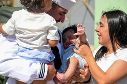 Aviation Boatswain’s Mate (Aircraft Handling) 3rd Class Isaac Gonzalez, assigned to the amphibious assault ship USS America (LHA 6), reunites with his family during the ship’s homecoming ceremony at Naval Base San Diego, Sept. 25, marking the end of its six-year forward deployment to Sasebo, Japan and the U.S. 7th Fleet area of operations. With a crew of over 1,200 Sailors and capable of deploying over 1,600 Marines, the America delivers a self-contained, mobile crisis response force, ranging from combat operations to humanitarian aid and disaster response. U.S. Navy photo by MC2 Madysson A. Ritter.