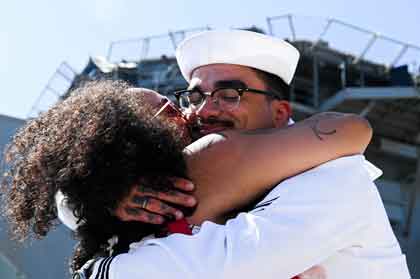 Fire Controlman 2nd Class Mason Statler assigned to the amphibious assault ship USS America (LHA 6), reunites with his family during the ship’s homecoming ceremony at Naval Base San Diego, Sept. 25, marking the end of its six-year forward deployment to Sasebo, Japan and the U.S. 7th Fleet area of operations. With a crew of over 1,200 Sailors and capable of deploying over 1,600 Marines, the America delivers a self-contained, mobile crisis response force, ranging from combat operations to humanitarian aid and disaster response. (U.S. Navy photo by Mass Communication Specialist 2nd Class Madysson A. Ritter)